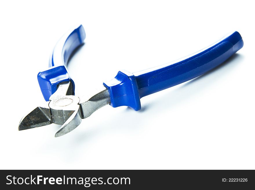 Metal pincers with blue plastic holder isolated