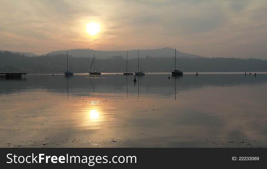 Cloudy and misty sun reflection on a november day. Cloudy and misty sun reflection on a november day