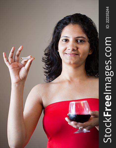 Indian beautiful glamour girl with wine and cigarette. Indian beautiful glamour girl with wine and cigarette