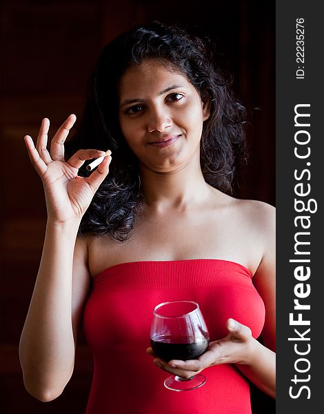 Indian beautiful glamour  girl with wine and cigarette. Indian beautiful glamour  girl with wine and cigarette