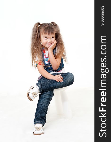 Little fashion dressed girl smiling isolated on white. Little fashion dressed girl smiling isolated on white