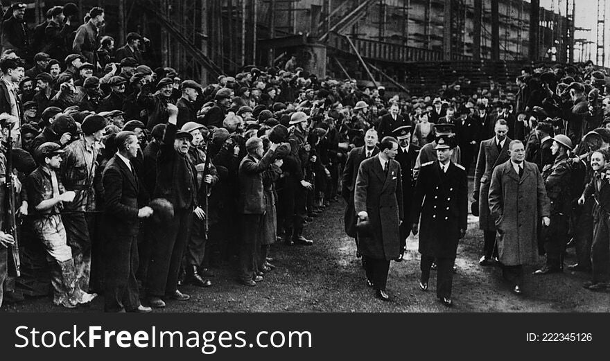 This is a Photograph of King George VI walking through the shipyard of John Readhead &amp; Sons Ltd, South Shields, flanked on either side by soldiers and workers, 7 April 1943.

Reference: 1061/1209/3

On 22 November Prince William will be visiting Sunderland and South Tyneside to take part in a number of youth development events.  During the visit he will also officially open Haven Point, the new leisure centre in South Shields.

To celebrate this Tyne &amp; Wear Archives has produced a short flickr set remembering past royal visits to the regionâ€™s shipyards.  Most of the visits featured here took place during difficult times and they gave a real boost to public spirits in the face of two World Wars.

A short blog relating to these images can be read  here .

These images are part of the Tyne &amp; Wear Archives Shipyard Collection. In July 2013 the outstanding historical significance of the Collection was recognised by UNESCO through its inscription to the UK Memory of the World Register.

&#x28;Copyright&#x29; We&#x27;re happy for you to share these digital images within the spirit of The Commons. Please cite &#x27;Tyne &amp; Wear Archives &amp; Museums&#x27; when reusing. Certain restrictions on high quality reproductions and commercial use of the original physical version apply though; if you&#x27;re unsure please email archives@twmuseums.org.uk. This is a Photograph of King George VI walking through the shipyard of John Readhead &amp; Sons Ltd, South Shields, flanked on either side by soldiers and workers, 7 April 1943.

Reference: 1061/1209/3

On 22 November Prince William will be visiting Sunderland and South Tyneside to take part in a number of youth development events.  During the visit he will also officially open Haven Point, the new leisure centre in South Shields.

To celebrate this Tyne &amp; Wear Archives has produced a short flickr set remembering past royal visits to the regionâ€™s shipyards.  Most of the visits featured here took place during difficult times and they gave a real boost to public spirits in the face of two World Wars.

A short blog relating to these images can be read  here .

These images are part of the Tyne &amp; Wear Archives Shipyard Collection. In July 2013 the outstanding historical significance of the Collection was recognised by UNESCO through its inscription to the UK Memory of the World Register.

&#x28;Copyright&#x29; We&#x27;re happy for you to share these digital images within the spirit of The Commons. Please cite &#x27;Tyne &amp; Wear Archives &amp; Museums&#x27; when reusing. Certain restrictions on high quality reproductions and commercial use of the original physical version apply though; if you&#x27;re unsure please email archives@twmuseums.org.uk
