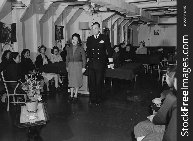 16-0022-002
b&amp;w 8x10 print
&quot;Navy nurses aboard the USS Repose &#x28;AH-16&#x29; at Tsingtao, China. Medical officer acts as interpreter during visit of Chinese nurses.&quot; Ca. June 22, 1948. Photo by Paul King, PhoM.  [hospital ship].
USN 392762