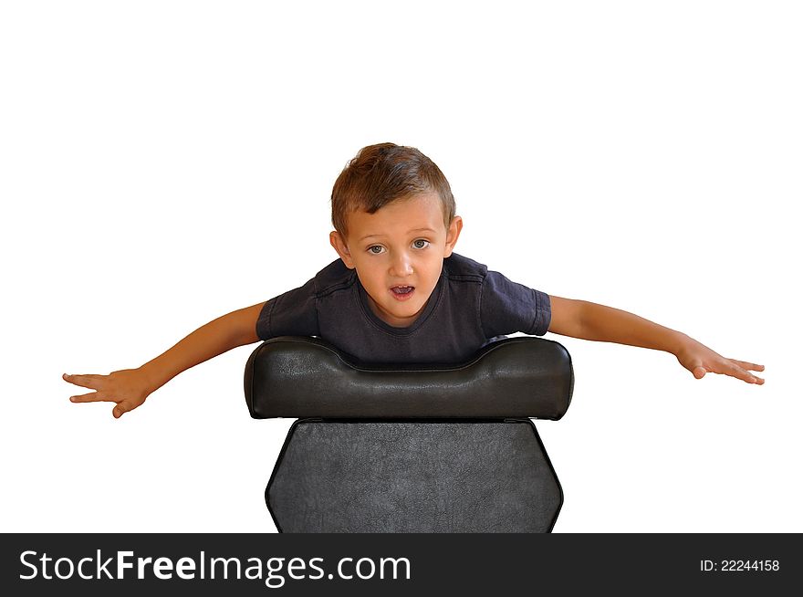 A boy lies on a soft black stools