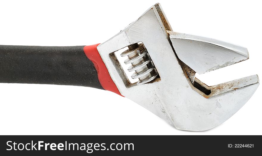 An adjustable wrench (spanner) on a white background