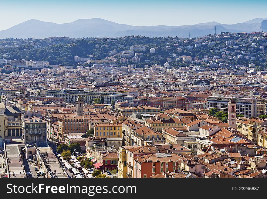 Historical part of Nice - luxury resort of French Riviera. Wonderful panoramic view of Nice with colorful historical houses of the old city, made from the Castle Hill. France, Europe, Cote D'Azur. Historical part of Nice - luxury resort of French Riviera. Wonderful panoramic view of Nice with colorful historical houses of the old city, made from the Castle Hill. France, Europe, Cote D'Azur