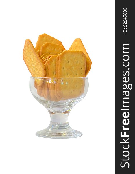 Cookies in a glass dish on white background