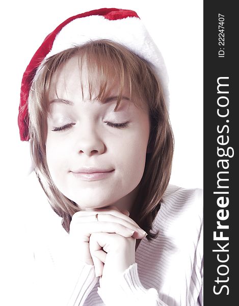 Very high key shot of girl with christmas hat. Very high key shot of girl with christmas hat