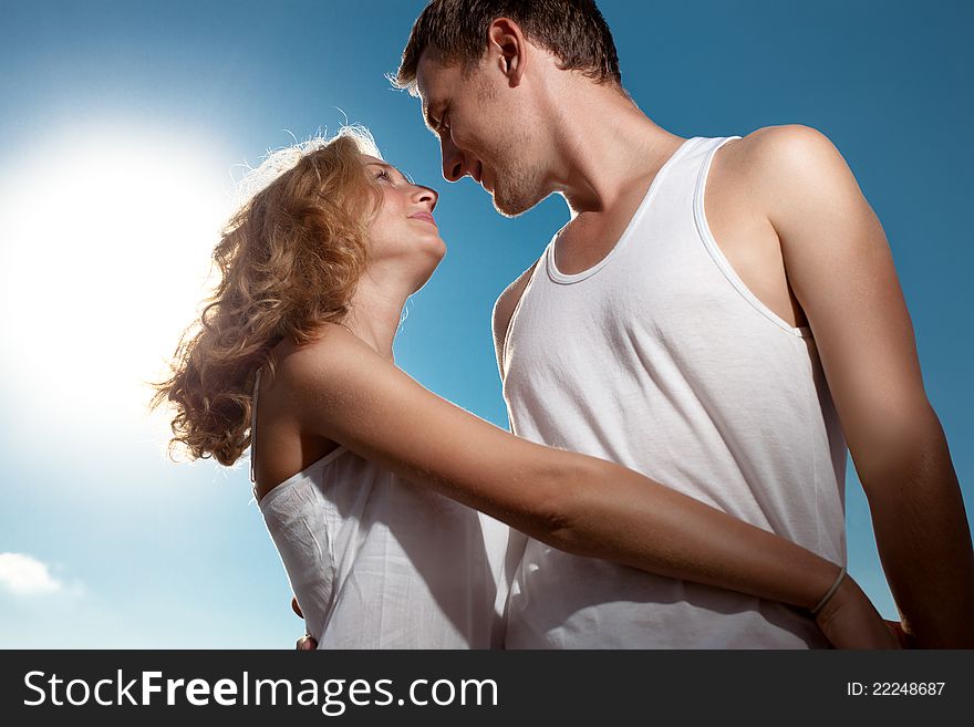 Stroking couple surrounded by  sunlight. Stroking couple surrounded by  sunlight