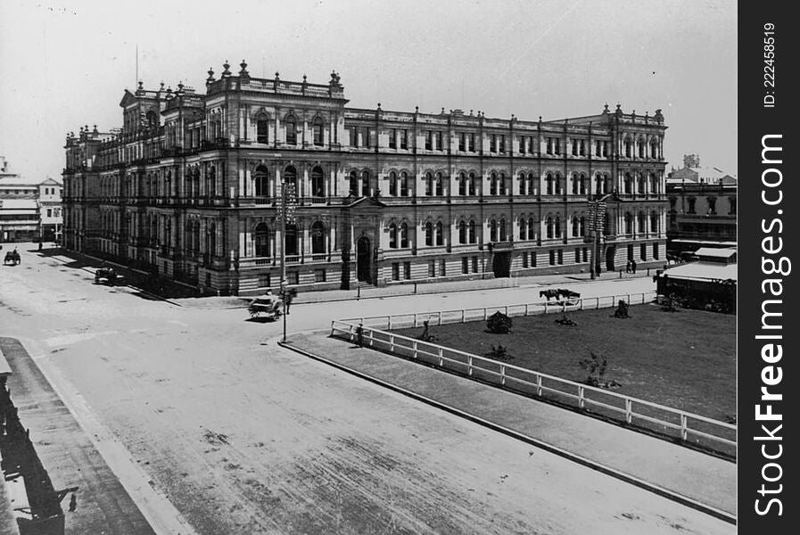 Photographer: unidentified

Location: Brisbane

Description: The Treasury Building, at the corner of George and Queen Streets, was erected in three stages between 1886 and 1928. In 1883 a design competition for a two-storeyed building was won by Melbourne architects Grainger and D&#x27;Ebro. However this design was never used as the Queensland Colonial Architect, John James Clark, argued that the site warranted a four-storeyed complex. Clark&#x27;s own design, entered in the competition prior to his appointment, was used. When completed in September 1889, the new building was occupied by the Premier, Colonial secretary, Registrar-General, Treasury, Mines, Works, Police and Auditor-General.


Stage two which completed the Elizabeth Street section was commenced almost immediately and was completed by February 1893. This new wing was occupied by the Registrar of Titles, Justice, Works, Public Instruction and the State Savings Bank. Work on the third state commenced in 1922 and officially opened in 1928, providing expanded accommodation for the existing tenants. The building is now home to an international casino and restaurants. 

View this page at the State Library of Queensland  hdl.handle.net/10462/deriv/67261 
Information about State Library of Queensland’s collection: www.slq.qld.gov.au/resources/picture-queensland. Photographer: unidentified

Location: Brisbane

Description: The Treasury Building, at the corner of George and Queen Streets, was erected in three stages between 1886 and 1928. In 1883 a design competition for a two-storeyed building was won by Melbourne architects Grainger and D&#x27;Ebro. However this design was never used as the Queensland Colonial Architect, John James Clark, argued that the site warranted a four-storeyed complex. Clark&#x27;s own design, entered in the competition prior to his appointment, was used. When completed in September 1889, the new building was occupied by the Premier, Colonial secretary, Registrar-General, Treasury, Mines, Works, Police and Auditor-General.


Stage two which completed the Elizabeth Street section was commenced almost immediately and was completed by February 1893. This new wing was occupied by the Registrar of Titles, Justice, Works, Public Instruction and the State Savings Bank. Work on the third state commenced in 1922 and officially opened in 1928, providing expanded accommodation for the existing tenants. The building is now home to an international casino and restaurants. 

View this page at the State Library of Queensland  hdl.handle.net/10462/deriv/67261 
Information about State Library of Queensland’s collection: www.slq.qld.gov.au/resources/picture-queensland