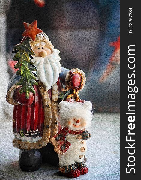 Christmas decorations santa claus and snowman standing together with texture