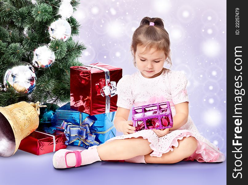 Beautiful girl with a Christmas tree