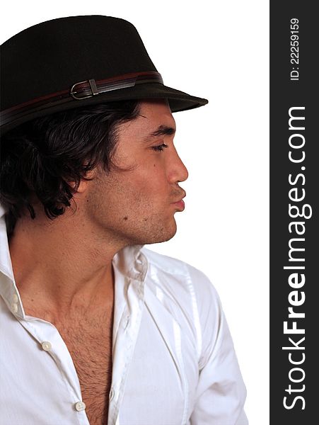 Fashion guy isolated with white shirt and hat looking in a funny expression. Fashion guy isolated with white shirt and hat looking in a funny expression