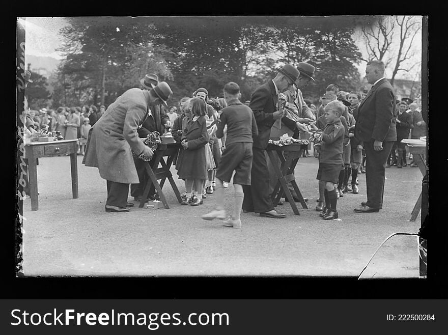 Creator: H. Allison &amp; Co. Photographers

Date: 13th May 1937

Original Format: Glass Plate Negative

Description: Children receiving Union Jack flags during celebrations of the Coronation of King George VI. Commissioned by the Ulster Gazette.

PRONI Ref: D2886/W/Portrait/175

Copying and copyright:
Please see http://www.proni.gov.uk/index/research_and_records_held/copying_and_copyright.htm

For Copy Orders, contact:
Email: proni@dcalni.gov.uk
For fees and charges see: http://www.proni.gov.uk/index/about_proni/are_there_any_fees_and_charges.htm. Creator: H. Allison &amp; Co. Photographers

Date: 13th May 1937

Original Format: Glass Plate Negative

Description: Children receiving Union Jack flags during celebrations of the Coronation of King George VI. Commissioned by the Ulster Gazette.

PRONI Ref: D2886/W/Portrait/175

Copying and copyright:
Please see http://www.proni.gov.uk/index/research_and_records_held/copying_and_copyright.htm

For Copy Orders, contact:
Email: proni@dcalni.gov.uk
For fees and charges see: http://www.proni.gov.uk/index/about_proni/are_there_any_fees_and_charges.htm