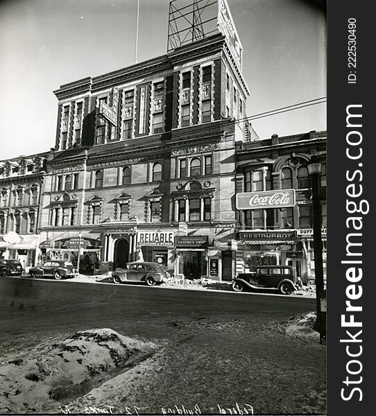 In 1898 the building was dramatically transformed into an entirely â€˜newâ€™ office building. Now five bays wide it was topped with elaborate side towers It later became the site of the Park Business College. The next renovation added two stories of brick so that the entire building is now a hodge podge of styles.

037-32022191131909. In 1898 the building was dramatically transformed into an entirely â€˜newâ€™ office building. Now five bays wide it was topped with elaborate side towers It later became the site of the Park Business College. The next renovation added two stories of brick so that the entire building is now a hodge podge of styles.

037-32022191131909