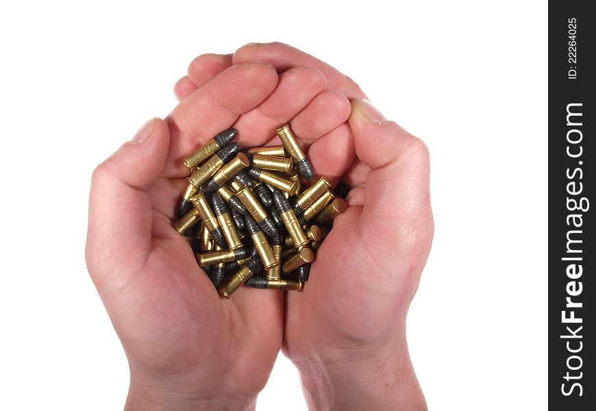 Handful of bullets in the open hands, isolated on white. Handful of bullets in the open hands, isolated on white.