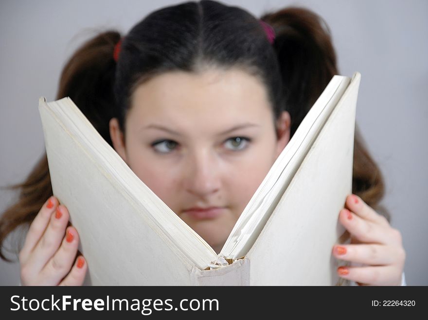 Schoolgirl With A Big Book