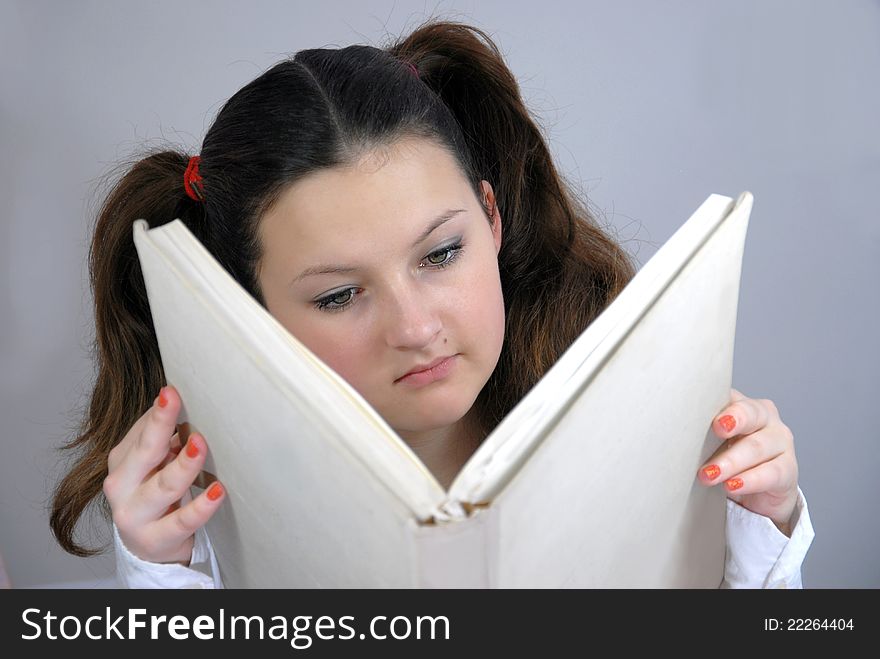 Schoolgirl Reading A Great Book