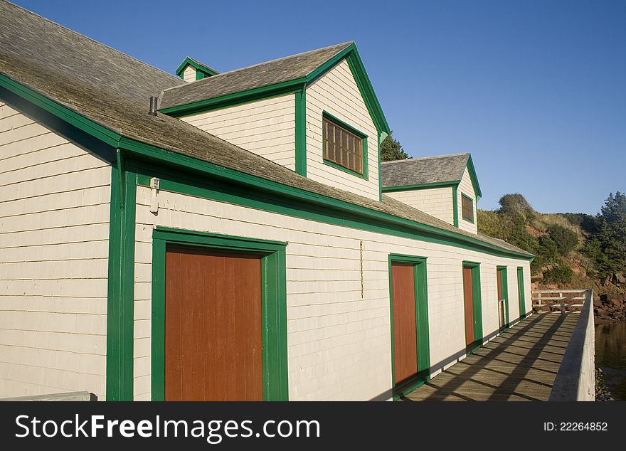 Cream colored building with red doors in
Canada