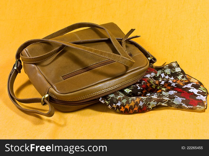 A real leather woman's shoulder bag and a silk scarf. A real leather woman's shoulder bag and a silk scarf