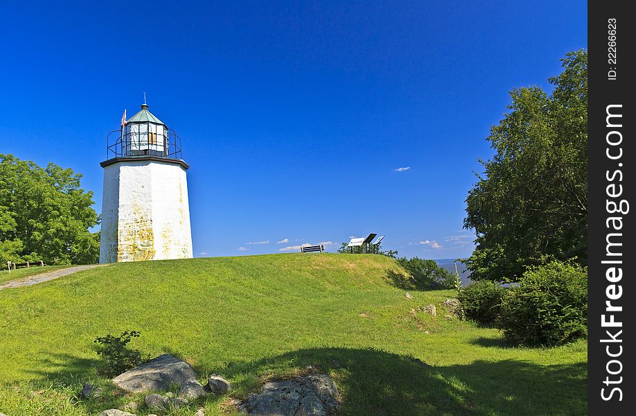 Stony Point Lighthouse on a grassy knoll overlooking the Hudson River in New York State