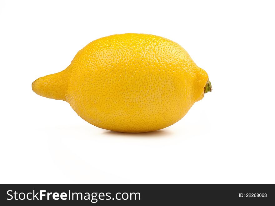 Yellow ripe lemon over the white background. Yellow ripe lemon over the white background