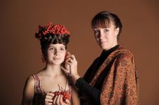 Makeup Stylist Adjusts The Model Stock Photo Makeup Stylist Adjusts The Model Stock Photo
