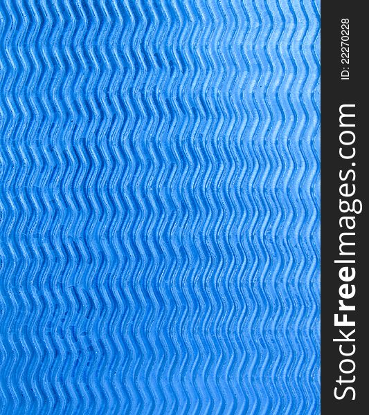 Wave design on blue-silver metal sheet