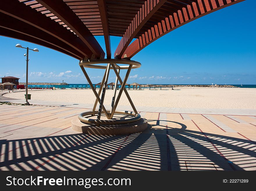 Modern design pergola gazebo pavilion in a summer beach coast resort. Modern design pergola gazebo pavilion in a summer beach coast resort