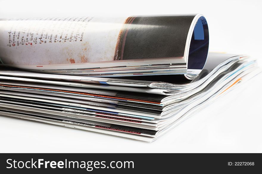 Various stacked and rolled magazines