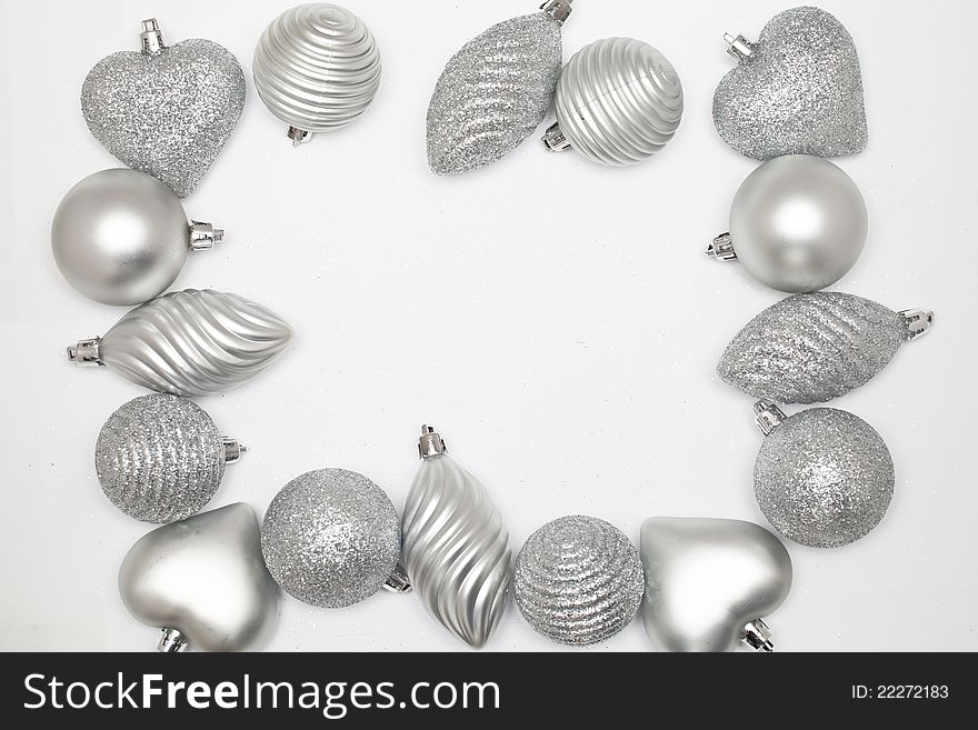 Many silver baubles on white background. Many silver baubles on white background