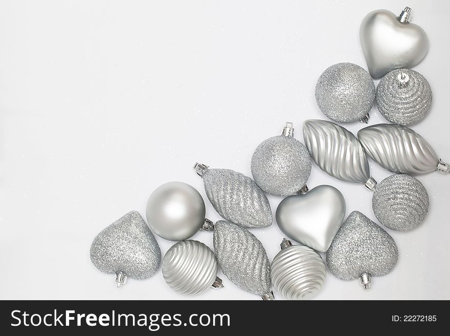 Many silver baubles on white background. Many silver baubles on white background