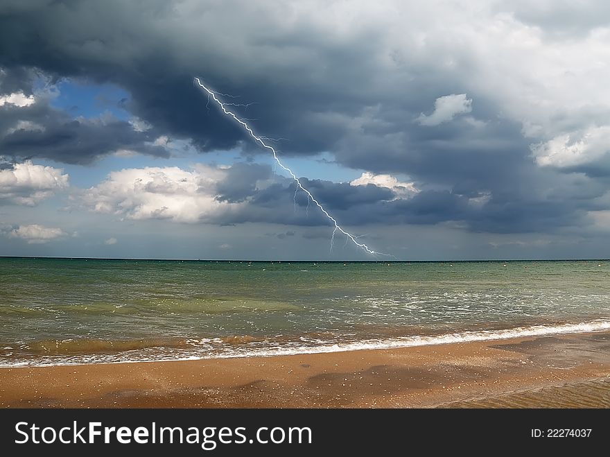 Lightning over the sea in autumn