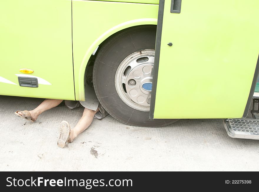 A bus being repaired on after it broke China. A bus being repaired on after it broke China.