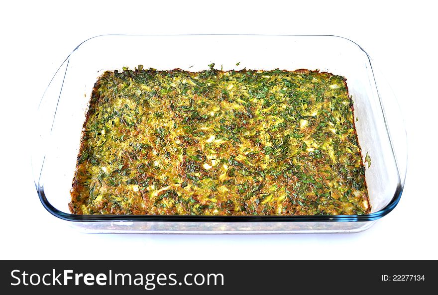 An omelet spread with parsley, baked inside a pyrex pan. An omelet spread with parsley, baked inside a pyrex pan