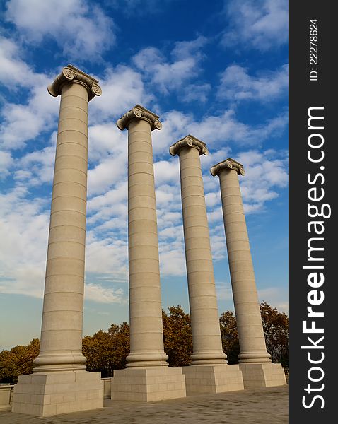 Four massive columns, blue sky