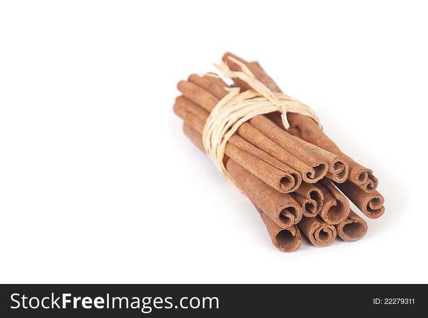 Bunch of cinnamon sticks on white background