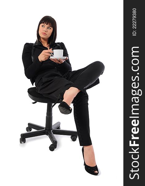 Business woman sitting on armchair with cup of coffee. Business woman sitting on armchair with cup of coffee
