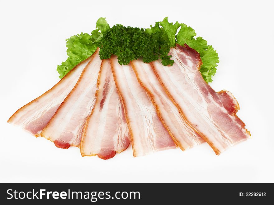 Tasty sliced pork bacon on white background