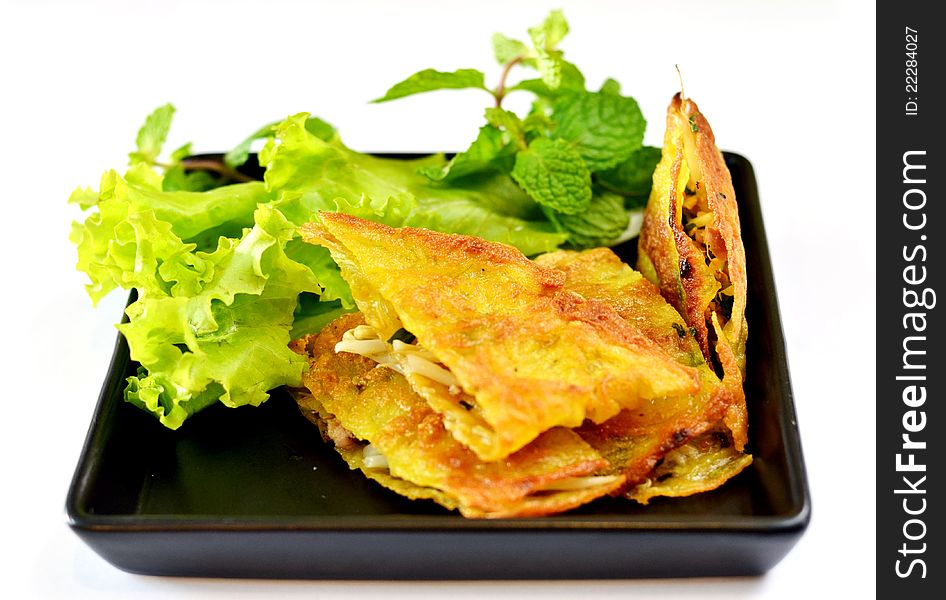 Vietnamese stuffed crispy omelette served with fresh vegetable. Vietnamese stuffed crispy omelette served with fresh vegetable