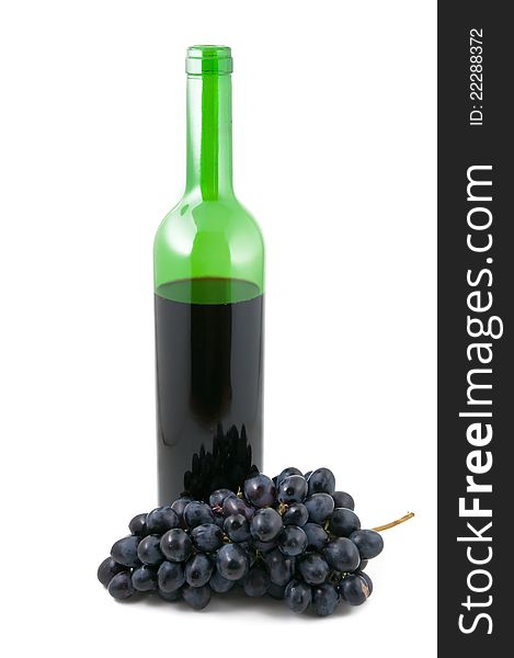 Bottle with wine and a cluster of grapes on the white background