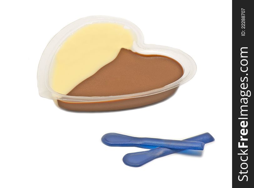 Chocolate and vanilla cream with two blue spoons on white background