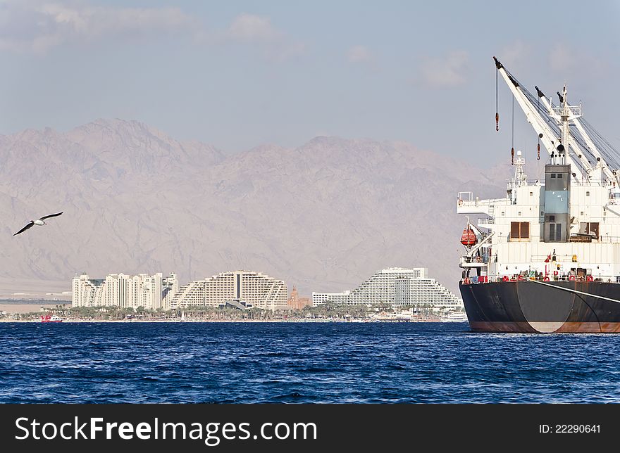 Resort hotels and cargo ship in Eilat, Israel