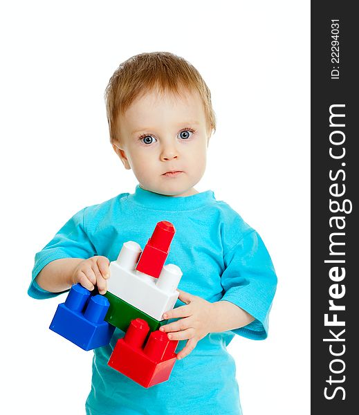 Little child with construction set over white background