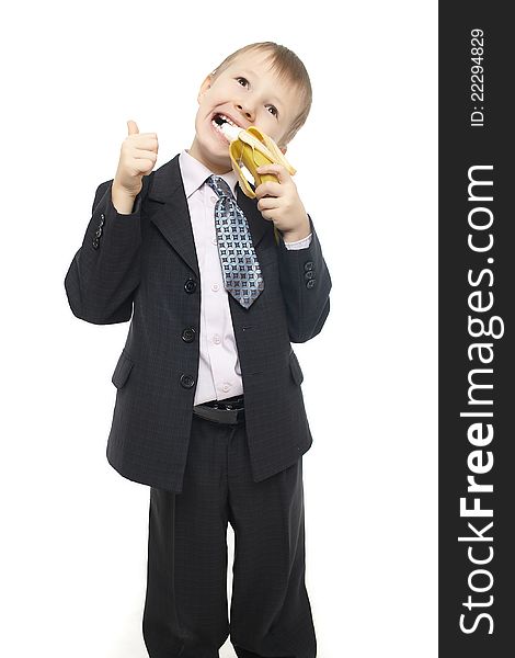 Beautiful Child In Costume Eating A Banana