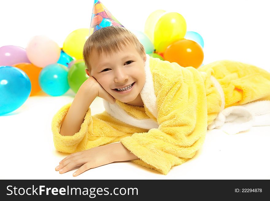 Little boy in dressing gown celebrates birthday