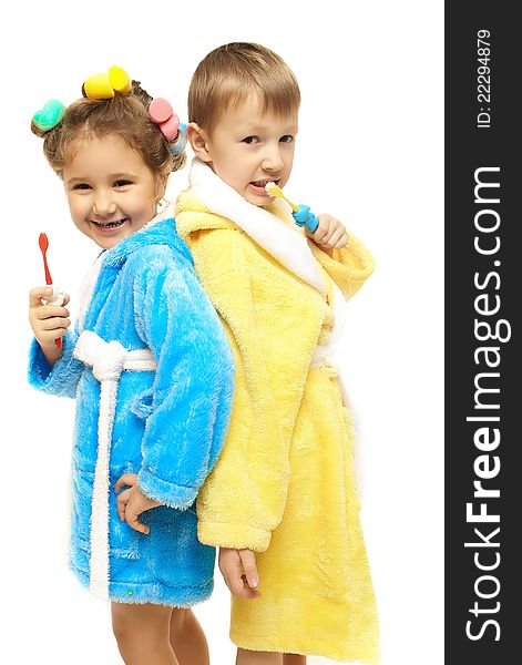 Brother sister dressing gown brush their teeth