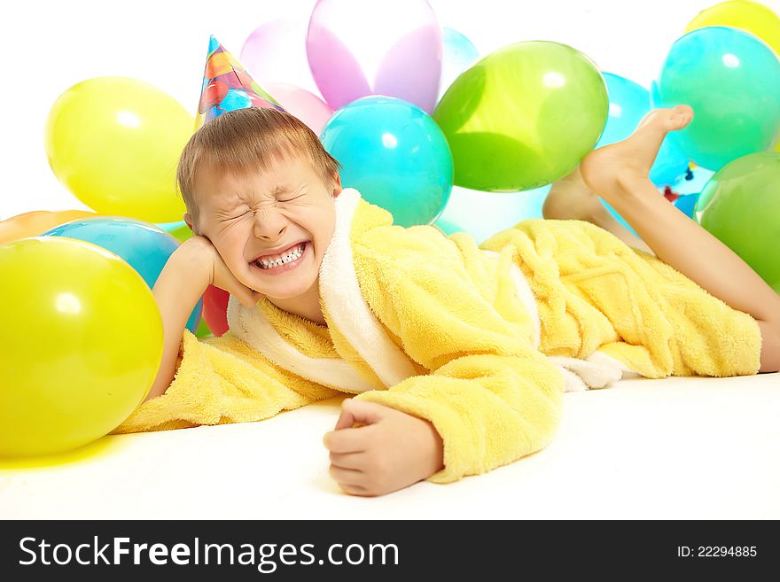 Little Boy In Dressing Gown Celebrates Birthday