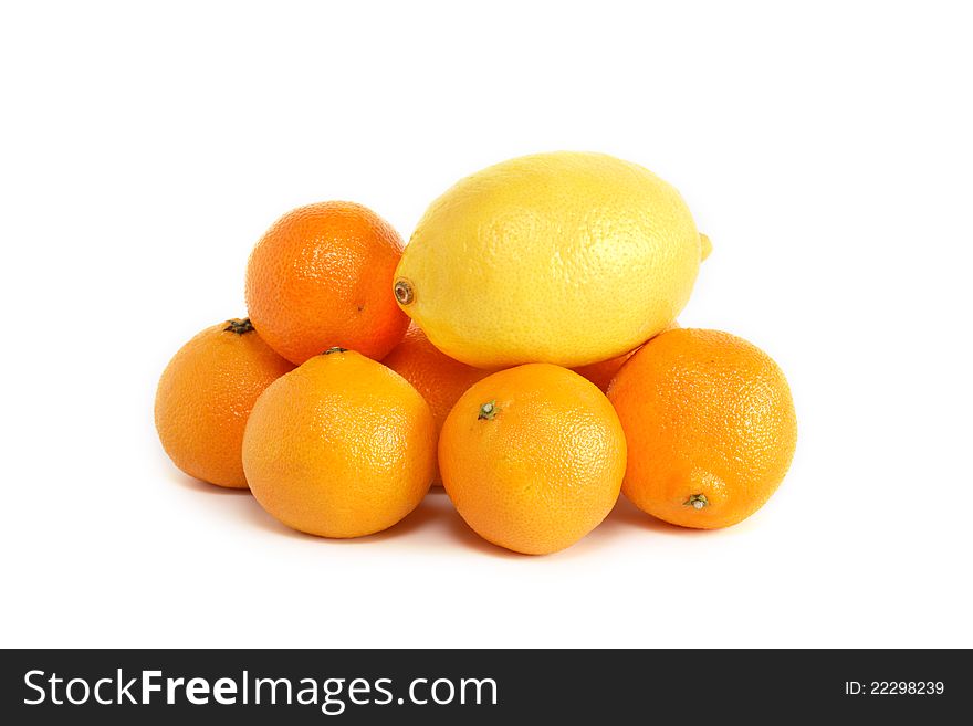Lemon lying on heap of tangerines on white background. Lemon lying on heap of tangerines on white background