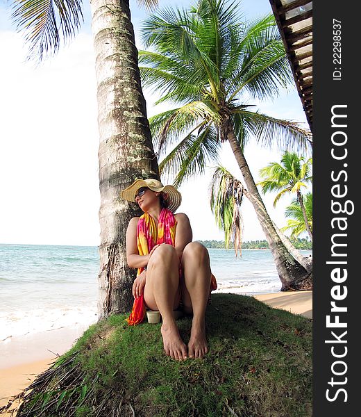 Woman relaxing on beach with coconut palms - Bahia - Brazil. Woman relaxing on beach with coconut palms - Bahia - Brazil